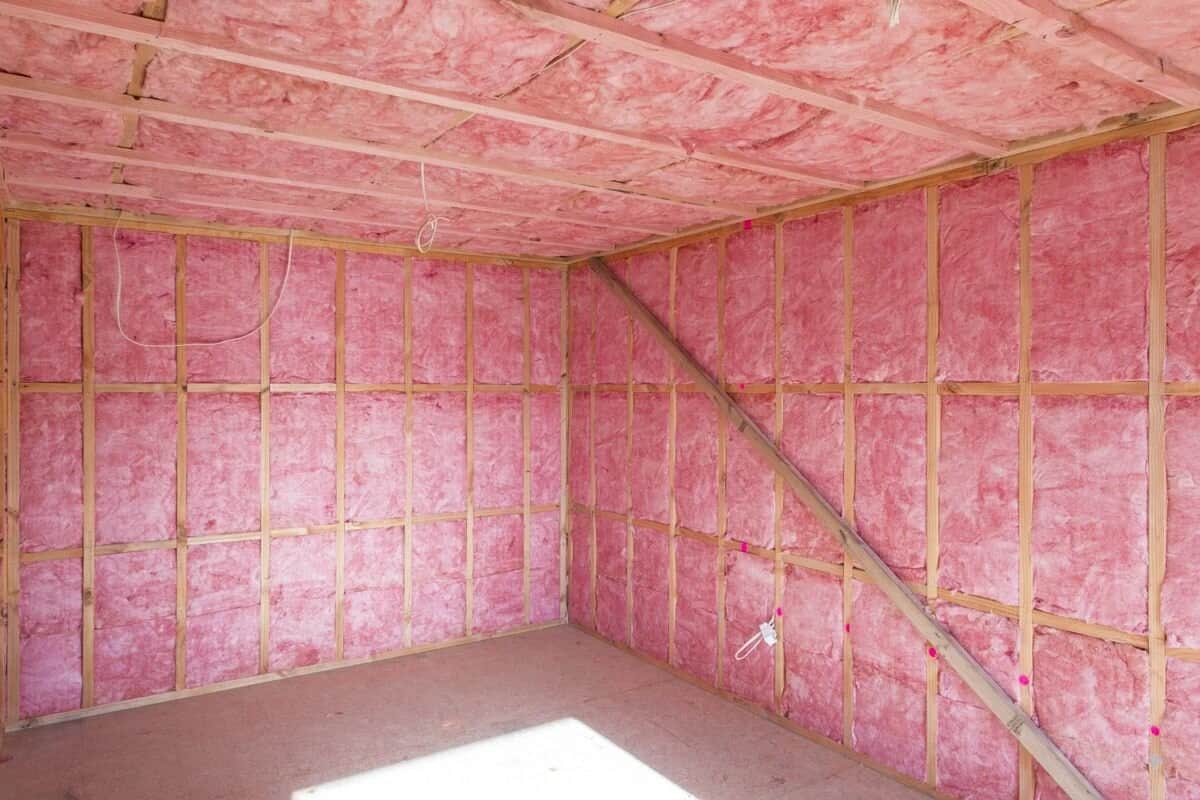 Batt insulation fitted between wall studs in a framed interior wall