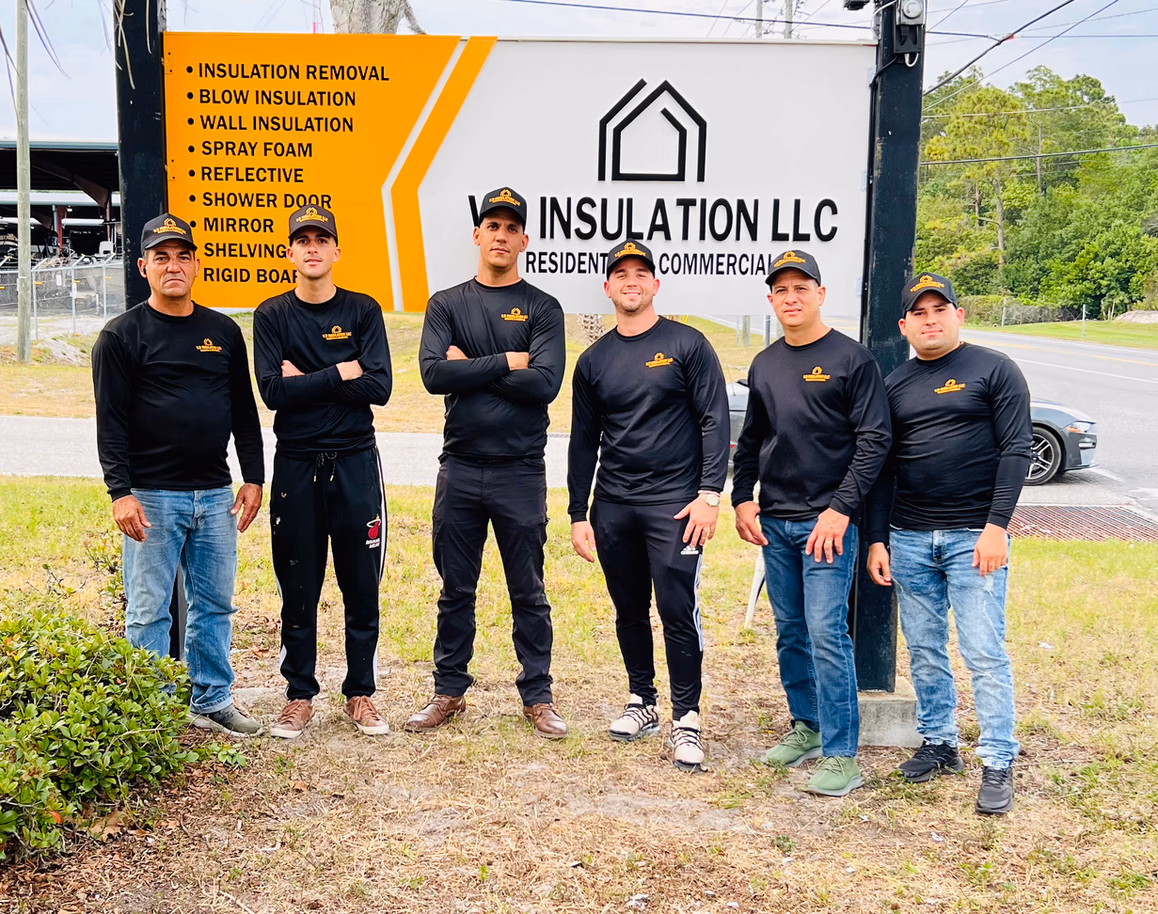 The founders of VR Insulation beside the company's branded trailer